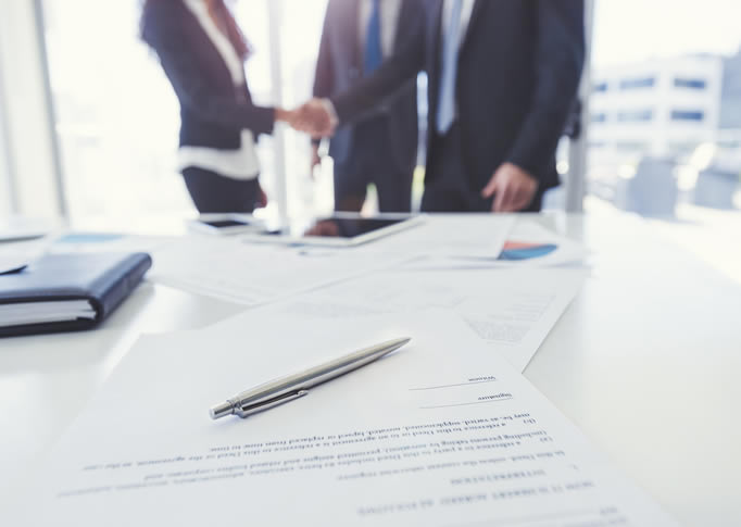 Litigation Support Services Litigation Support Services handshake in the background