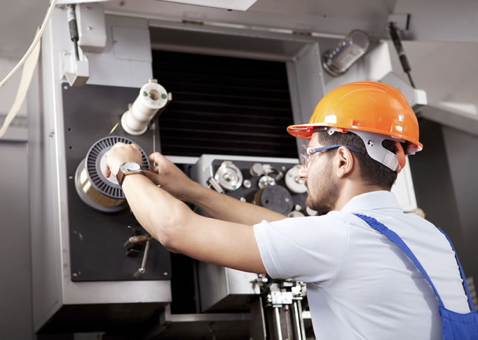 man in hard hat maintaining facilty support
